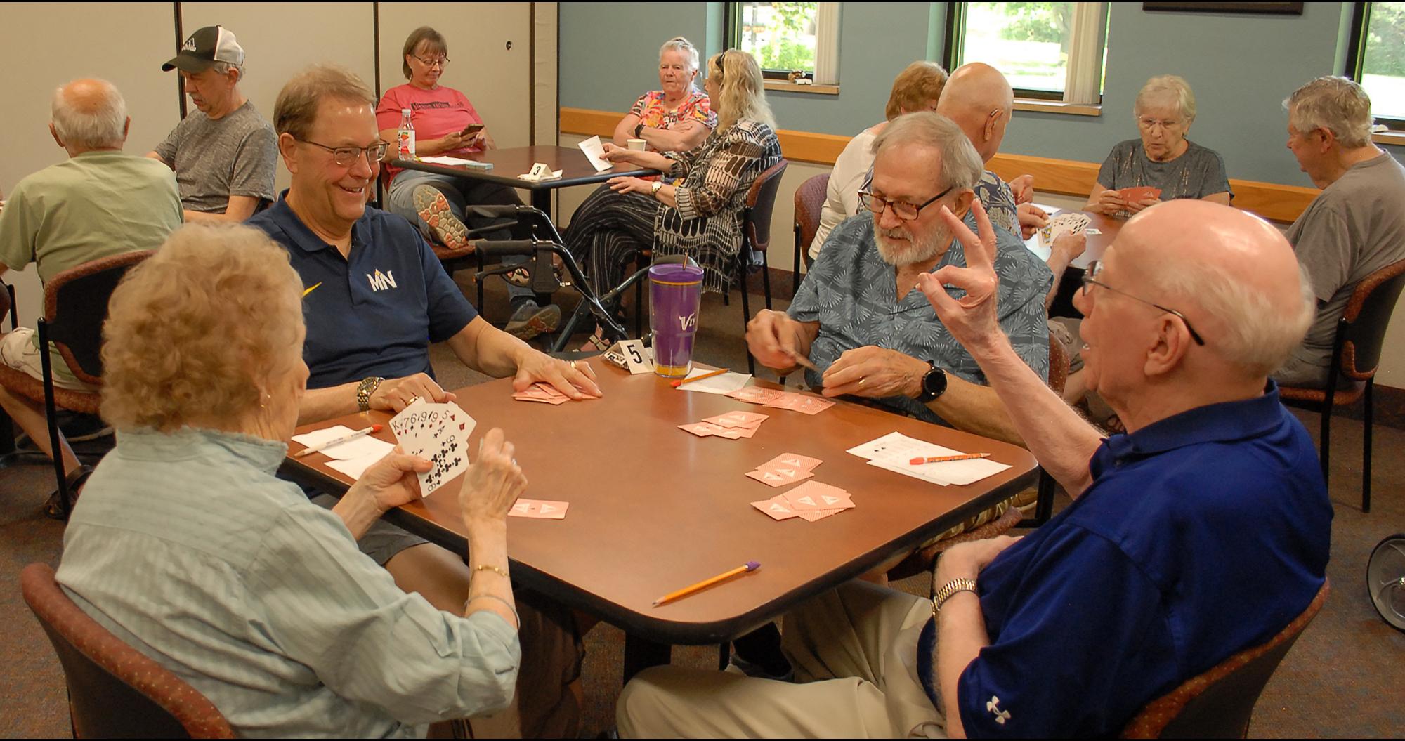Members playing the card game 500